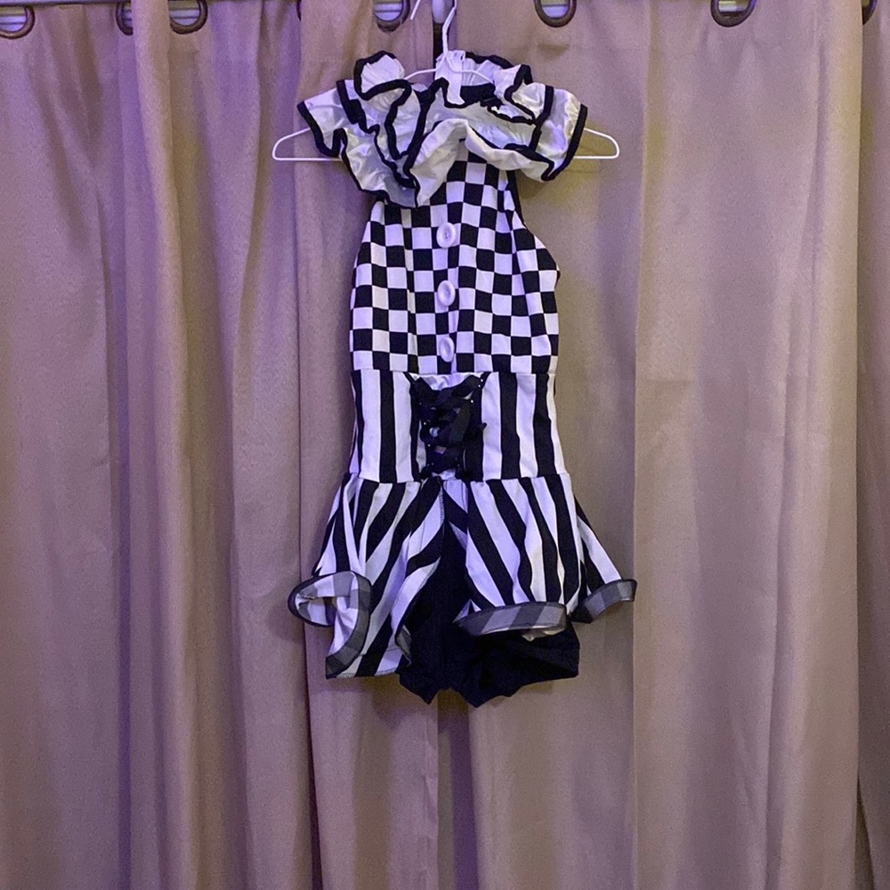 i’m guessing clown or joker outfit